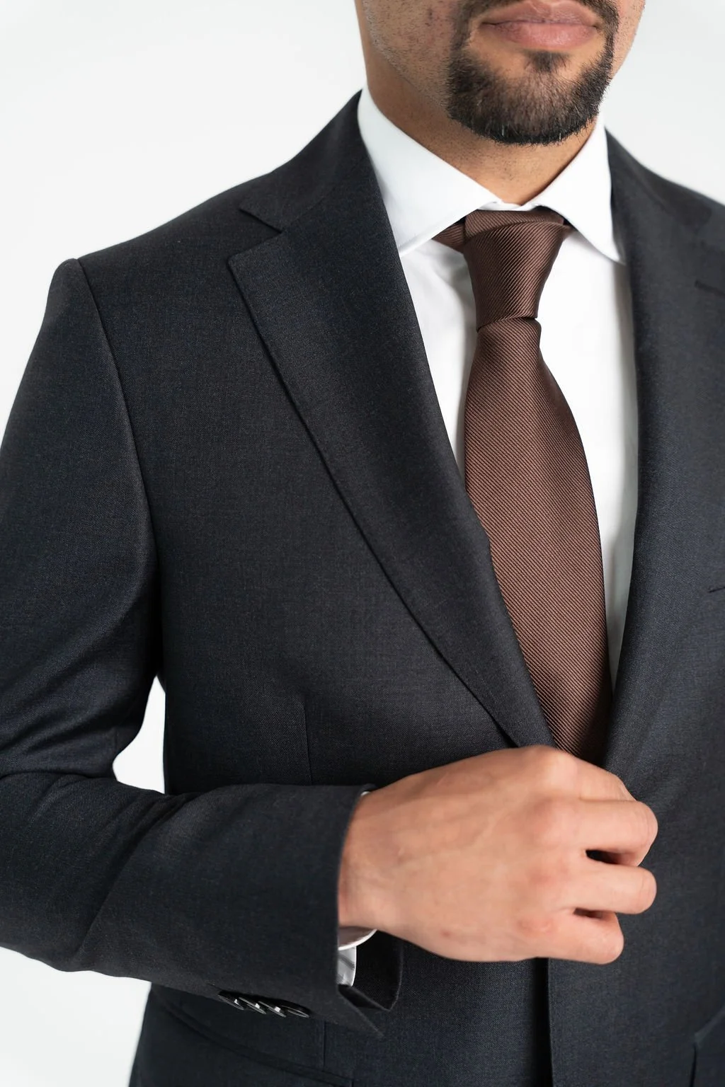 Close-up of Calvaresi black suit separate showcasing luxurious Super 110's wool fabric and refined tailoring details