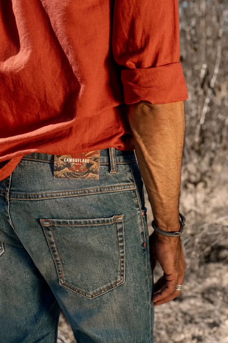 Close-up of Camouflage denim jeans with premium pocket construction