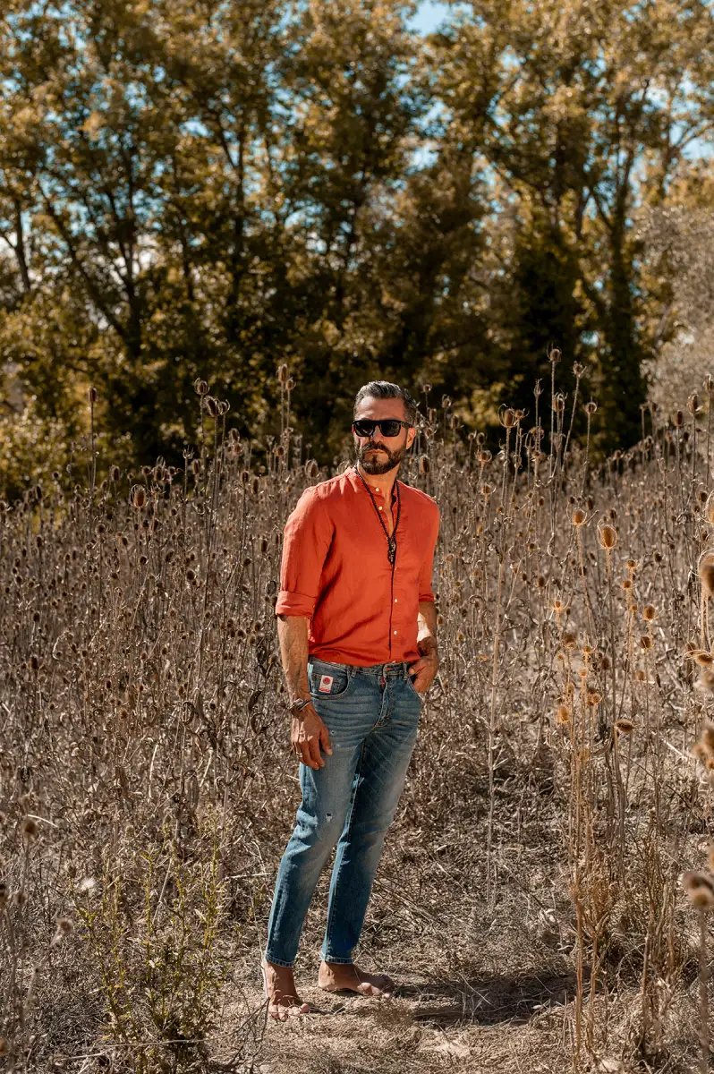 Camouflage orange knit polo and denim in outdoor lifestyle setting