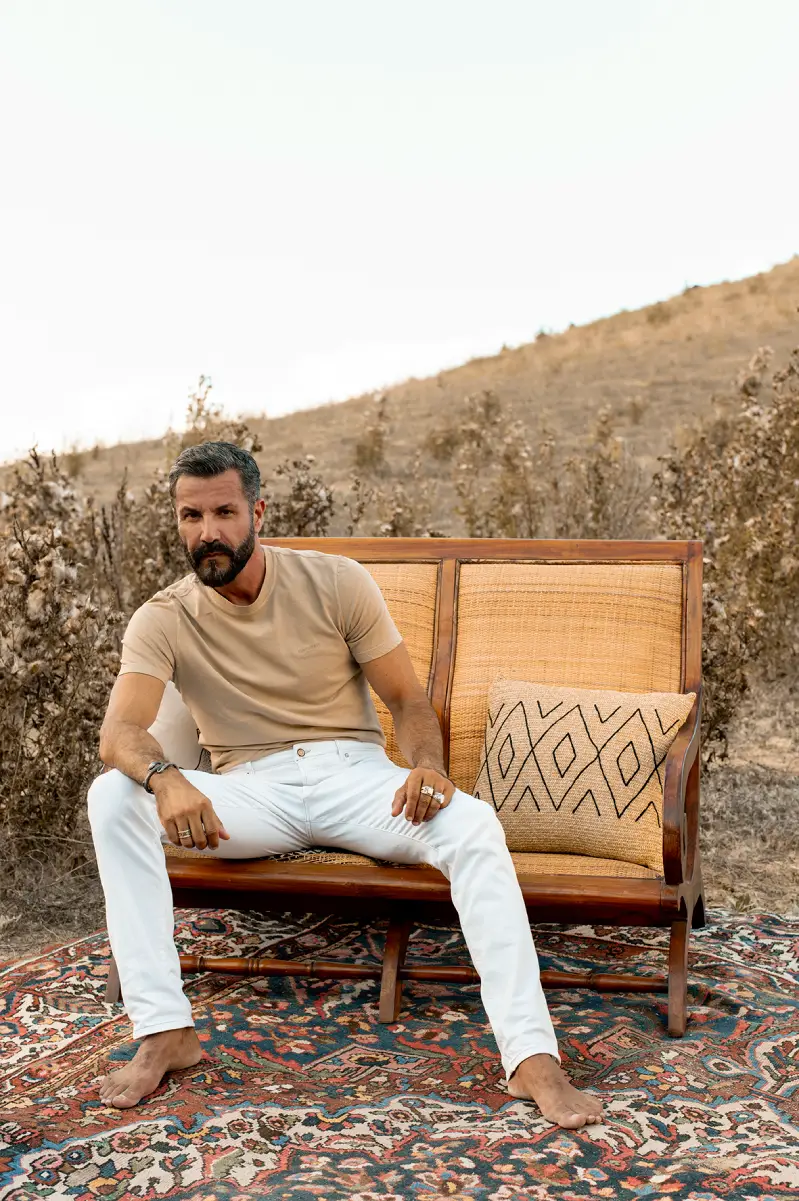 Camouflage beige knit polo and denim styled for modern casual wear