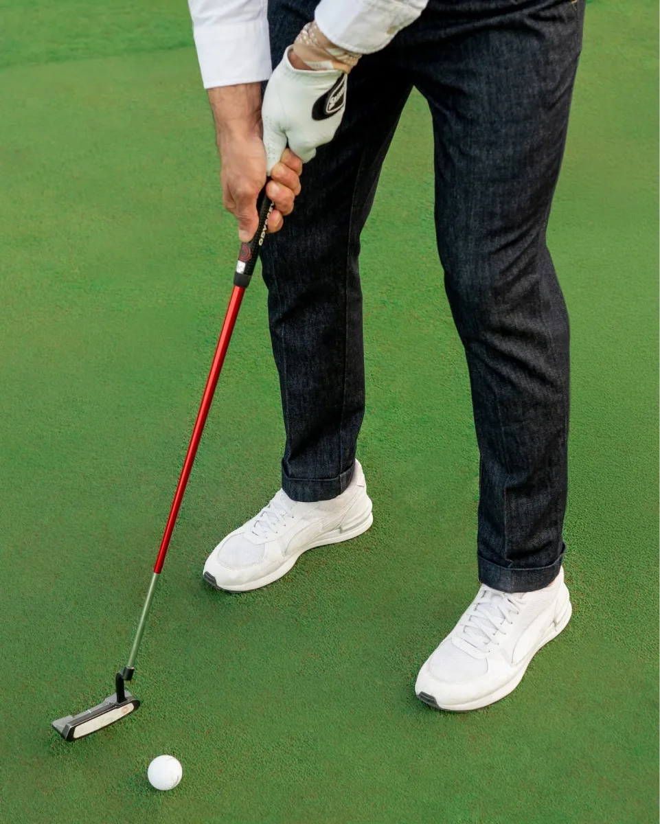 Camouflage premium denim jeans paired with golf-inspired casual styling