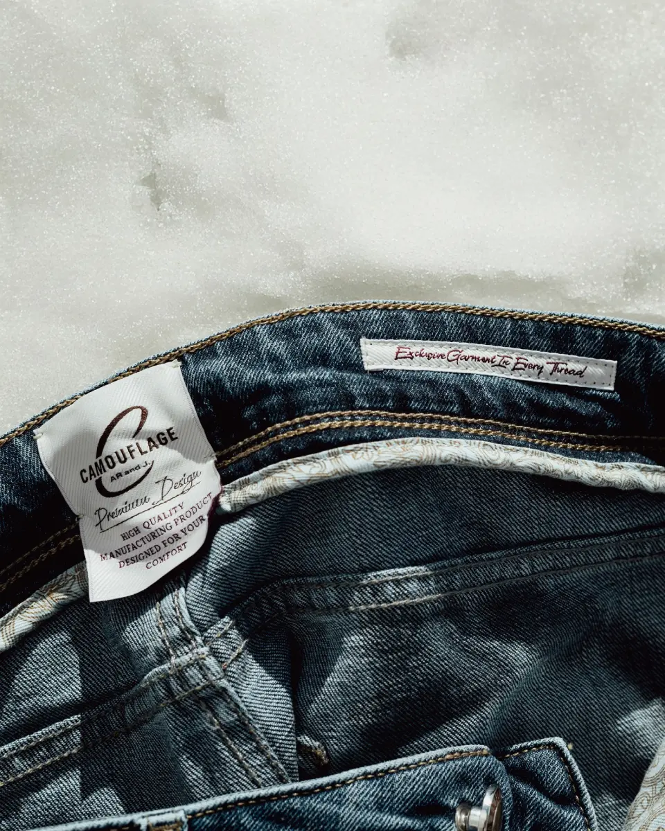 Close-up of Camouflage denim interior construction and branded label