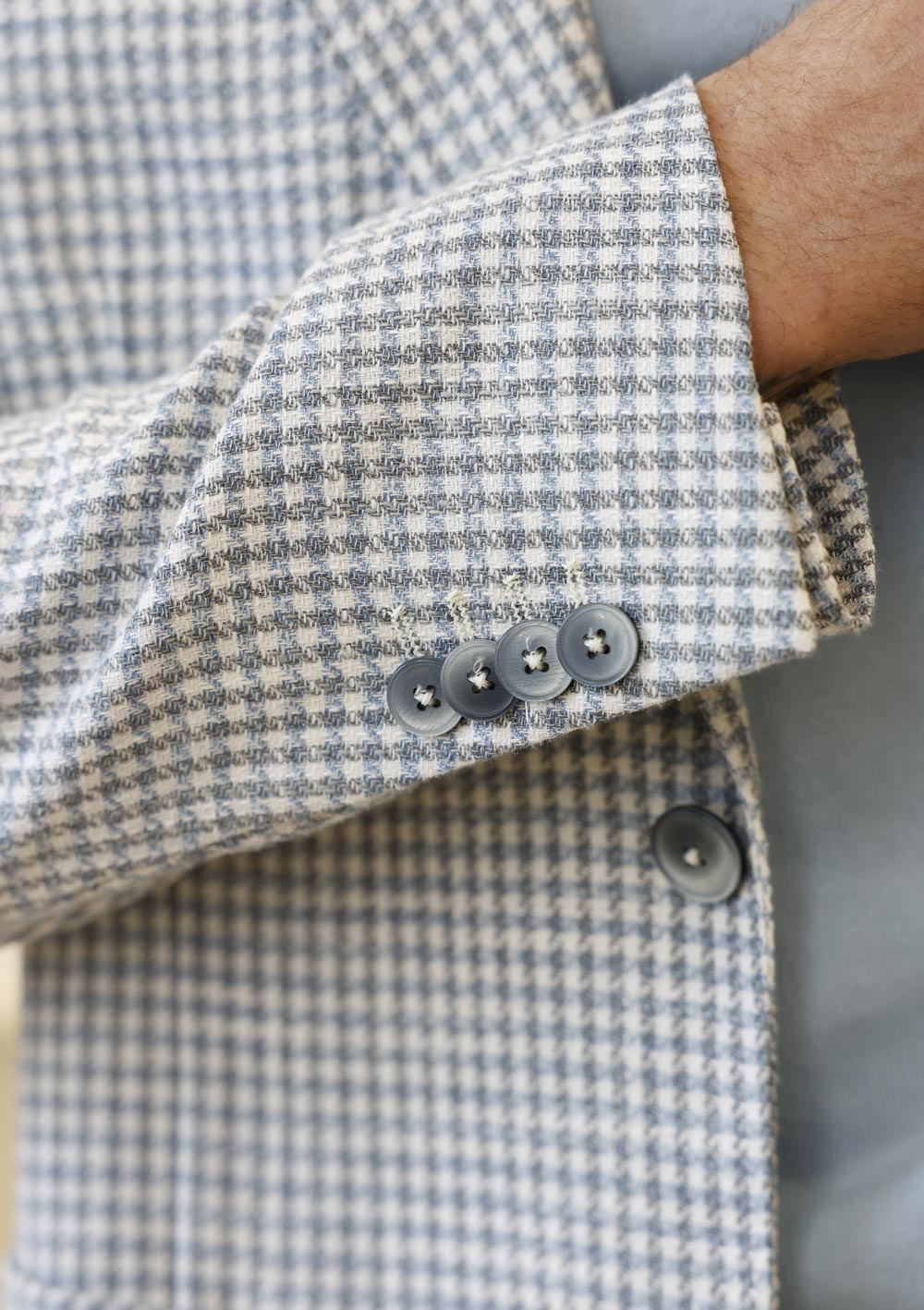 Close-up of Olliver Grey checked sport coat fabric and button detail